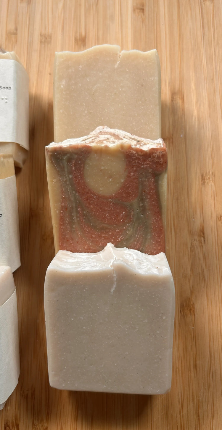 Beach & Dunes naked bars — three unwrapped tallow soap bars stacked on bamboo, handcrafted swirled textures in cream and earth tones