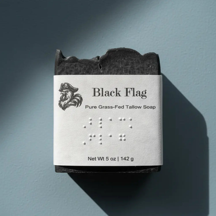 Black Flag | Grass Fed Tallow Soap Bar Blind Pirate Soap Co. Label is brailled with the name of the soap