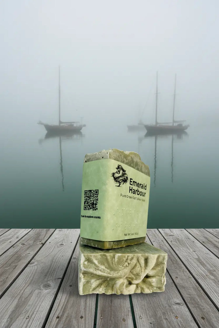 Two Emerald Harbour bars stacked on a rustic dock, QR side panel facing out, misty mood veiling moored vessels beyond.