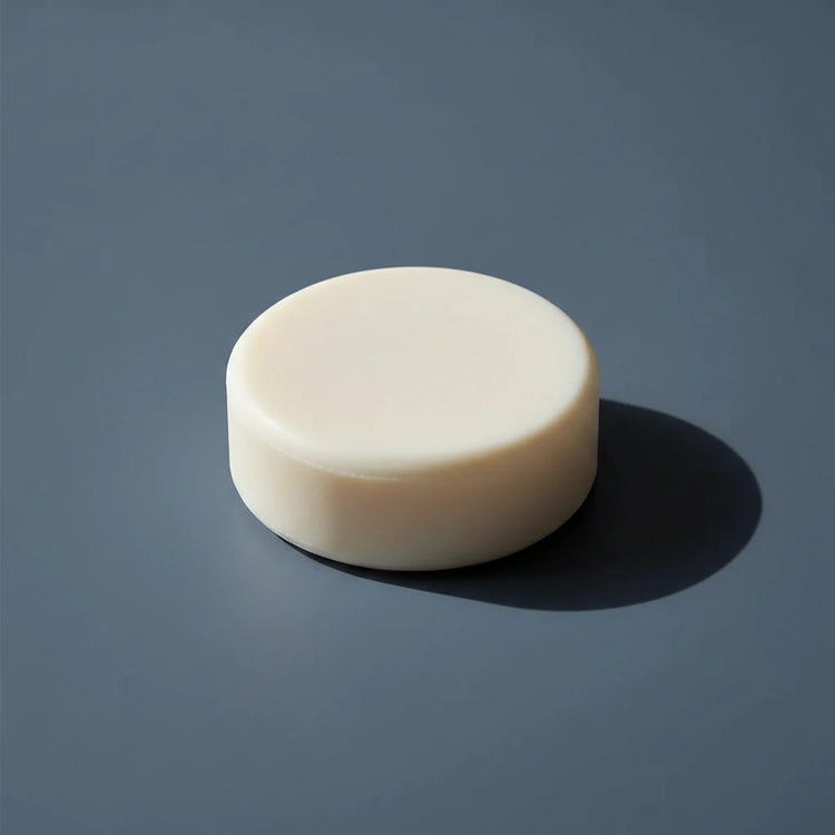 Still Water | Unscented Tallow Shampoo Bar BLIND PIRATE SOAP Co. All white tallow shampoo bar, hockey puc round.