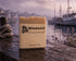 Windward tallow soap bar with label on wet dock, mooring rope, lavender, misty harbor at dusk. Blind Pirate Soap Co.
