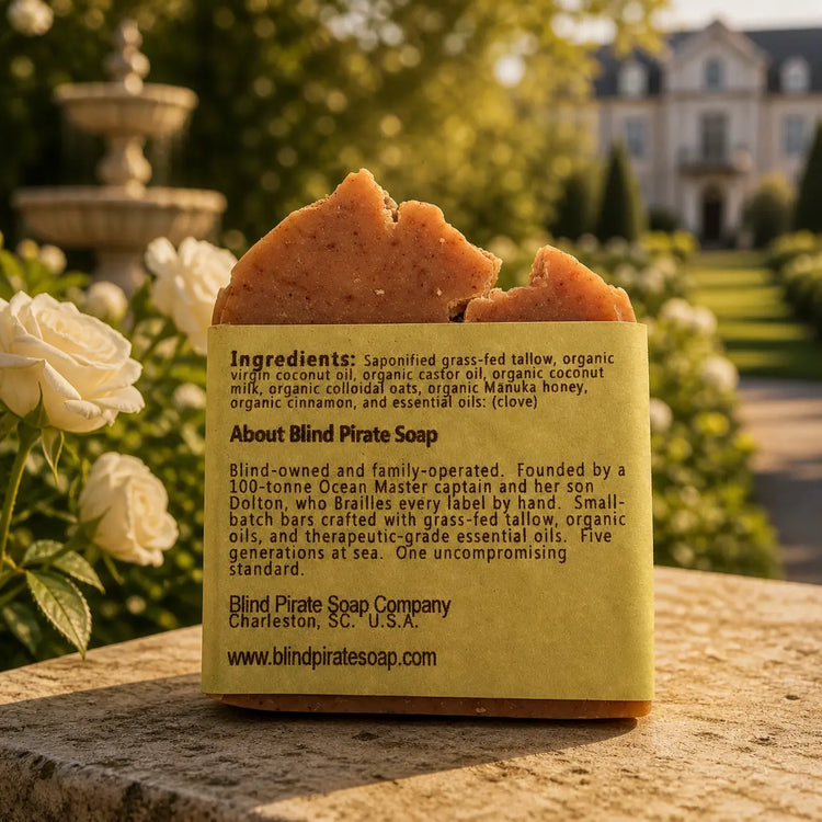 The Stable tallow soap bar, ingredients panel facing out, warm golden estate stable yard light. Blind Pirate Soap Co.
