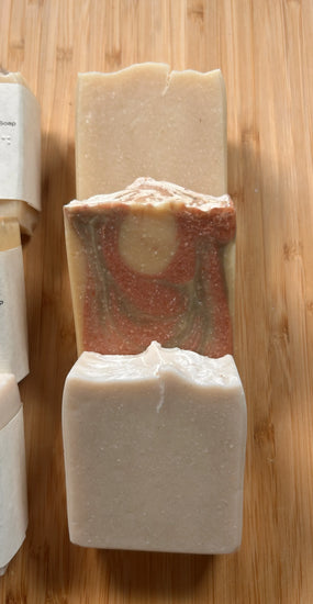 Beach & Dunes naked bars — three unwrapped tallow soap bars stacked on bamboo, handcrafted swirled textures in cream and earth tones