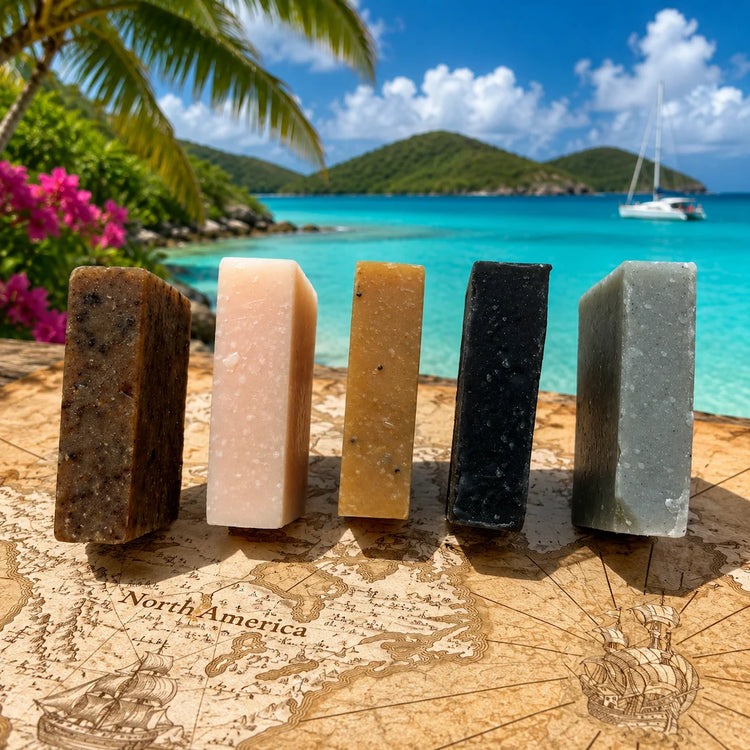 Stowaway Discovery Set | Five dark-toned Stowaway soap bars standing upright, tropical beach setting
Blind Pirate Soap Co.
