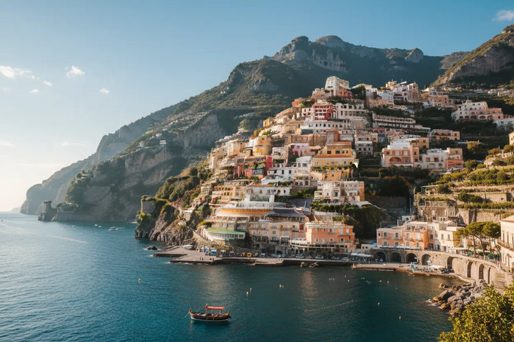 Amalfi Coast | Pastel villages cascading down the sun-drenched Amalfi cliffs, lemon groves clinging to the terraces, the flat calm Mediterranean glittering below.