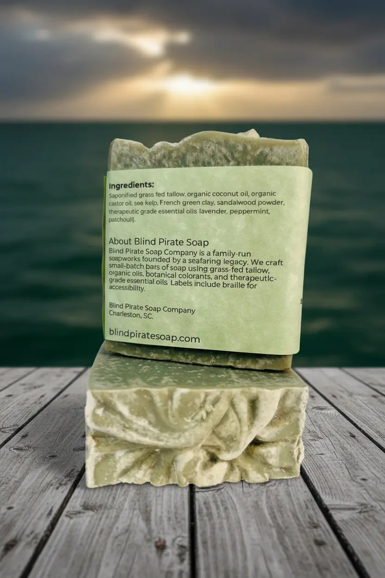 Emerald Harbour back panel clearly showing ingredients and Blind Pirate Soap story, resting on a sun-warmed Hamptons dock