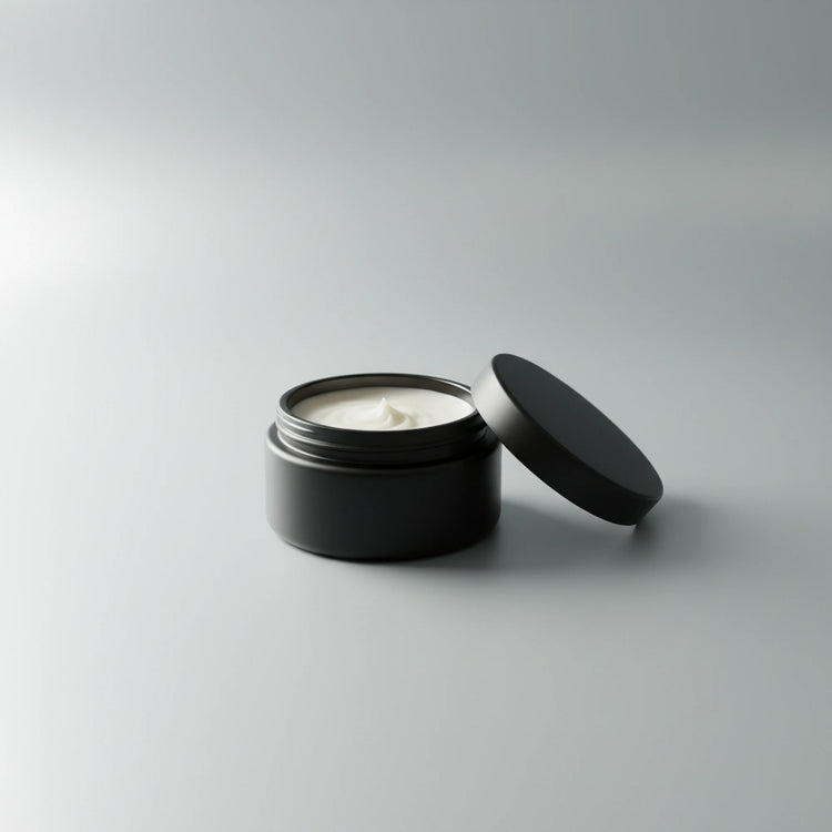 ⚓ Dead Calm — Unscented Beard Balm Blind Pirate Soap Co. An open matte black cosmetic jar filled with white cream, with its matching lid 