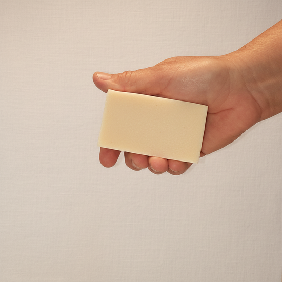 Rustic cut Driftwood & Stone grass-fed tallow soap bar, warm tan with grey mineral flecks. Blind Pirate Soap Co