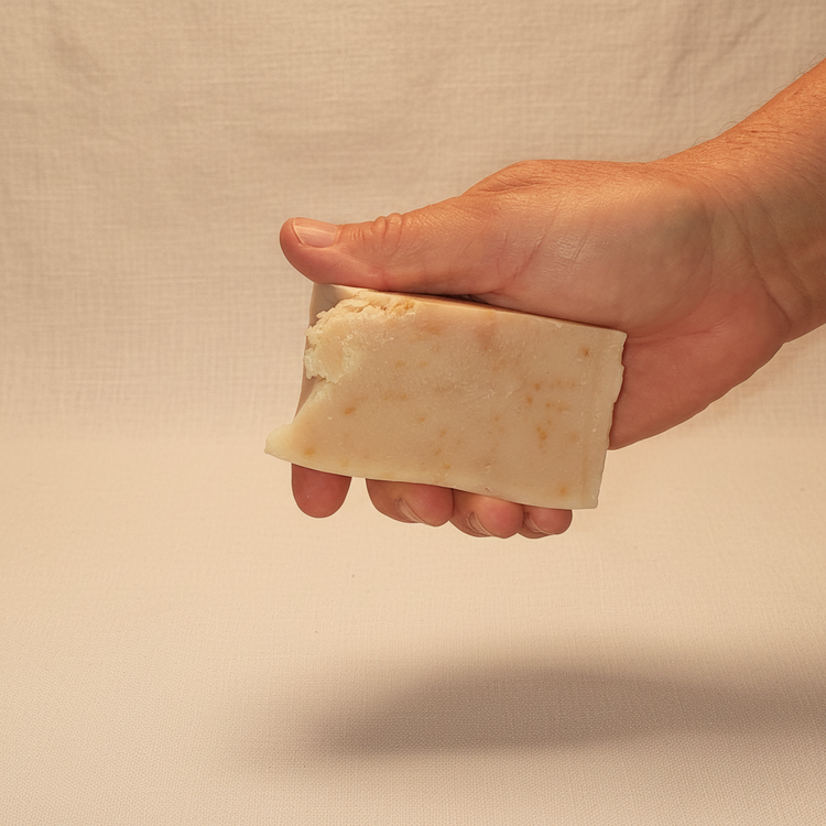 Rustic cut Milk & Honey grass-fed tallow soap bar, soft ivory with warm golden swirls. Blind Pirate Soap Co.