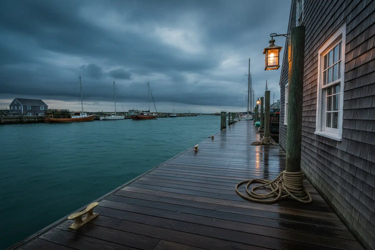 Nantucket Dock — Stormy Emerald Water sky reflects across a quiet quayside, lights beginning to glow in the stillness
