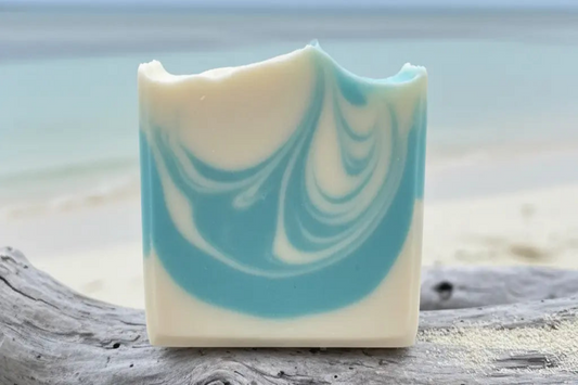 Ocean handcrafted soap bar with soft natural blue swirls in gentle turquoise and powder blue tones like Exuma beach water on driftwood