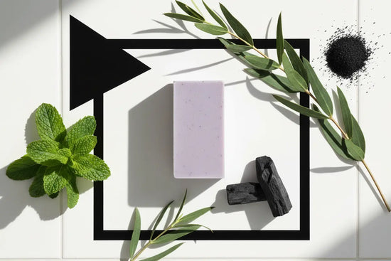 Petals & Loam - soap on dark slate with peppermint leaves, eucalyptus and activated charcoal