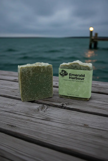 Stacked — Weathered Dock Emerald Harbor Two bars side by side, one unwrapped, jetty lights glowing behind.