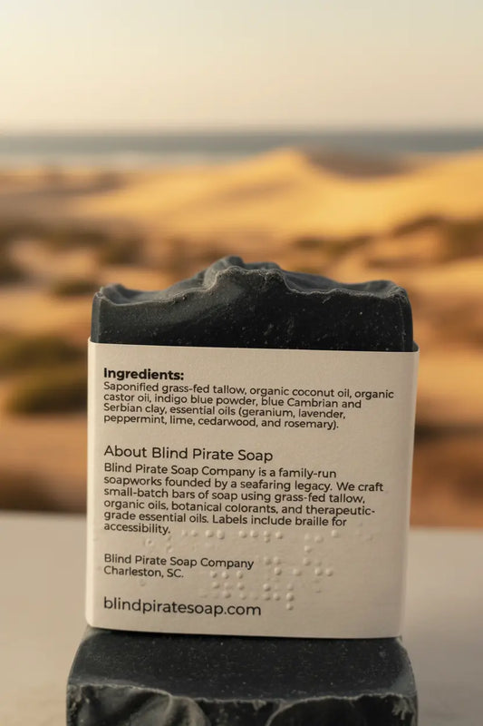Surfer Suds tallow soap back panel with ingredients list, golden hour light on the longest left wave in Chicama, Peru.