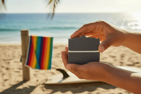 Surfer Suds - Surf Lifestyle Sun-kissed hands holding surfer suds soap with beach towel and surfboard in sunny beach setting