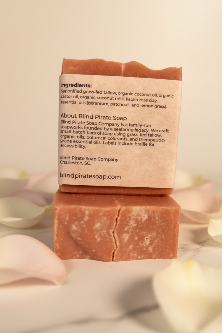 Velvet Rose — back panel clearly showing ingredients and Blind Pirate Soap story, bars nestled in soft pink rose petals.